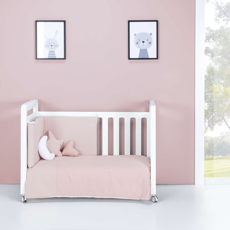 Textil de cuna en rosa empolvado, para habitación de niña